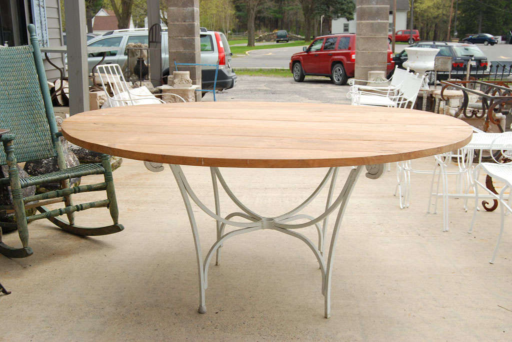 Teakwood tabletop made with reclaimed wood and vintage metal base. Table can be used indoor or outdoor, garden or porch table. Top and base can be sold separately. Table top is 1