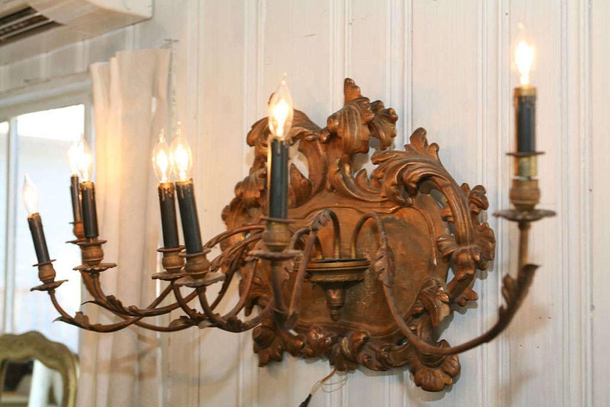 Fabulous giltwood seven-arm Italian wall sconce. Great as a wall decoration, above a bed or in any room.