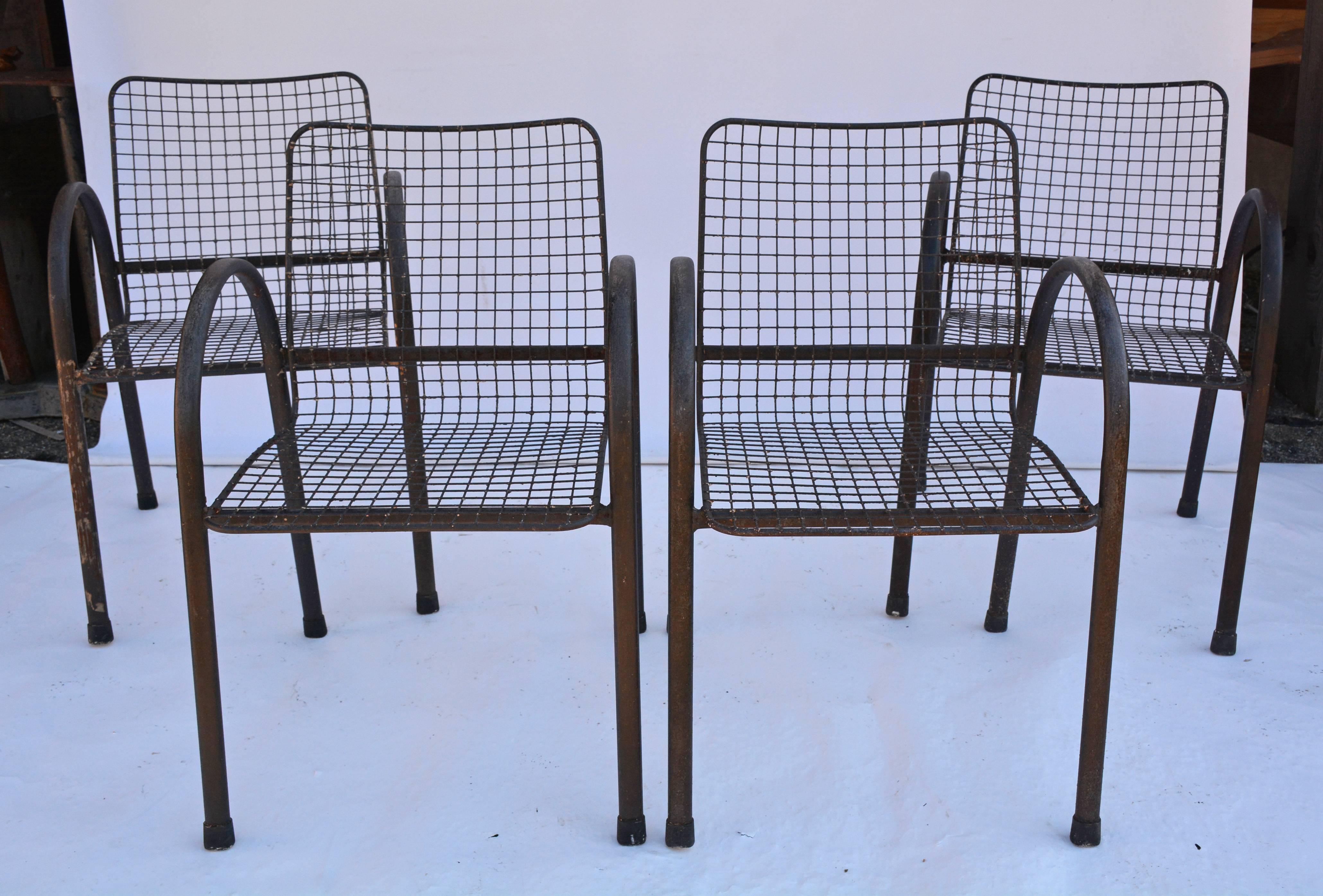 Set of four U-shaped arms metal garden dining armchairs with airy wire mesh seats and backs attached to cross bars. Great for patio, porch dinging and seating, very comfortable!