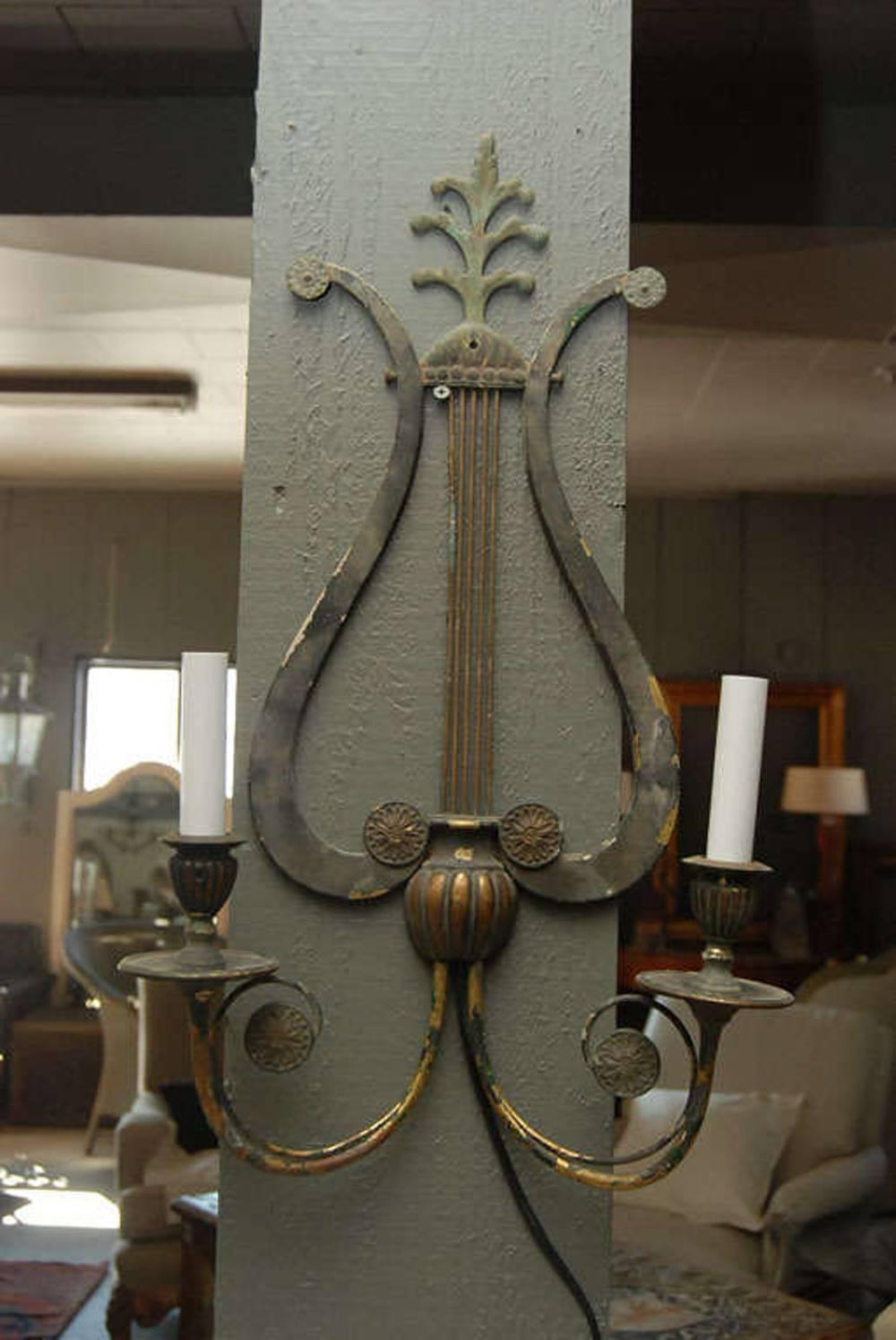 Wonderful patina wall sconce in musical clef design. Newly rewired.