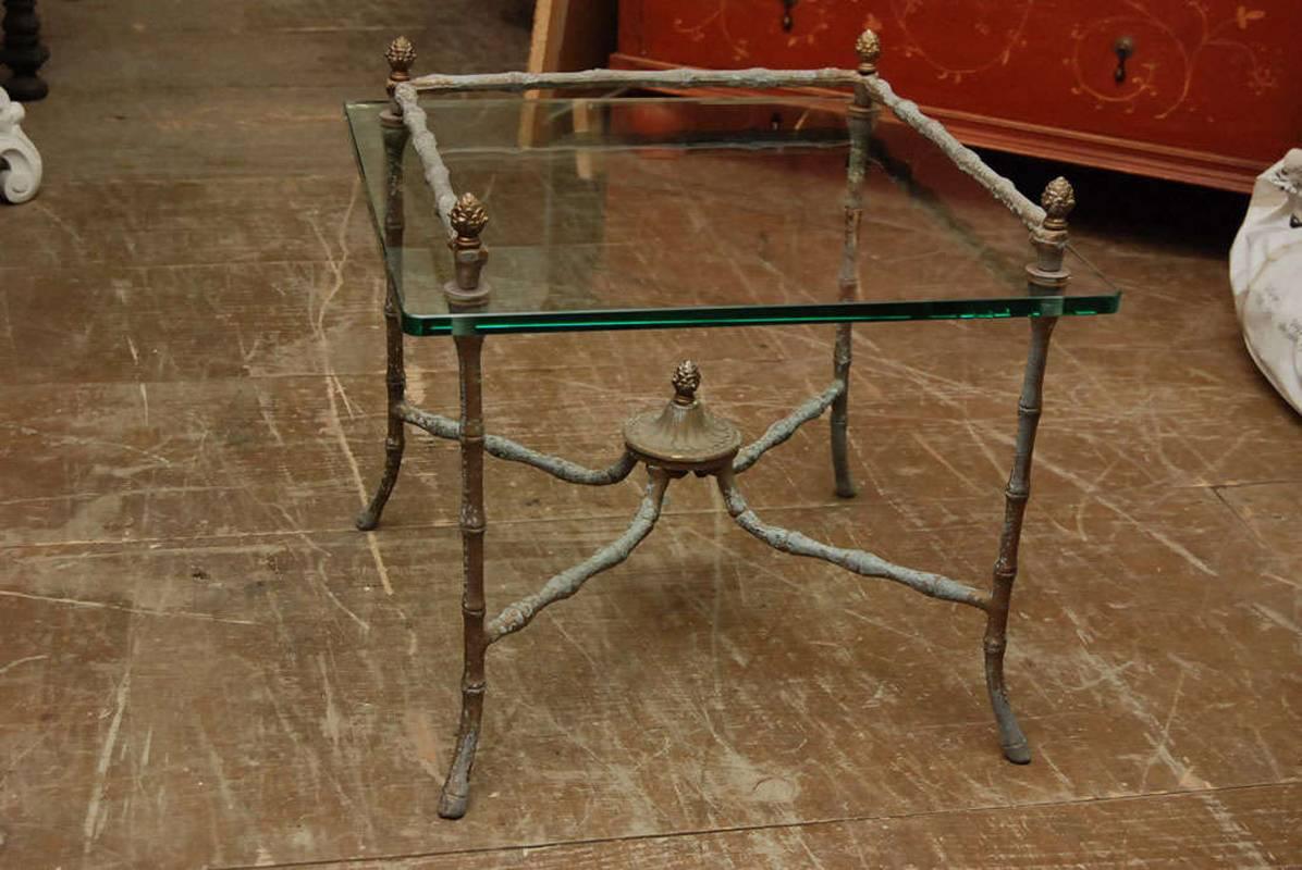 Pair of Giacometti inspired side tables with 1/2 inch glass top and wonderful patina.