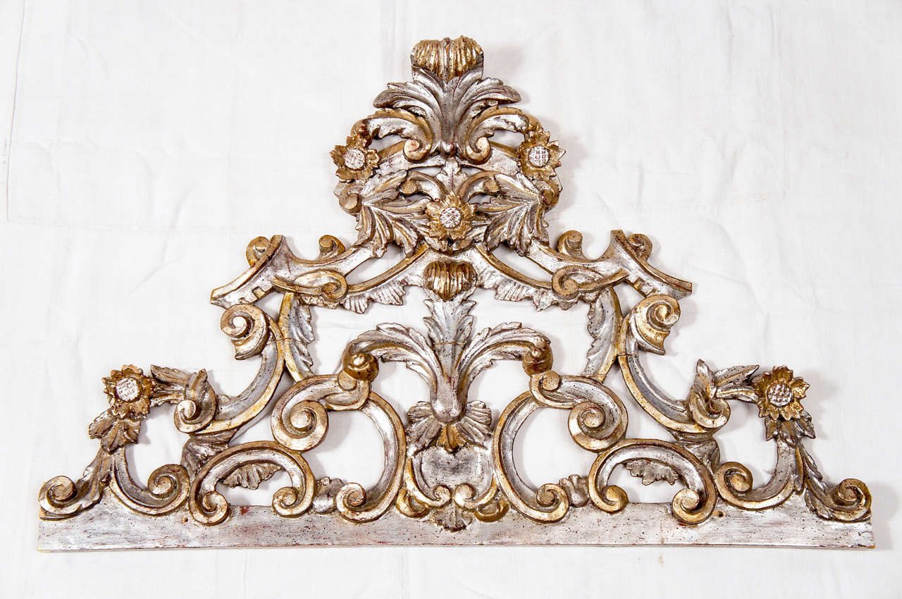 Silver and gold gilt decorative sculpture pediment with scroll work, sunflowers and leaves. Could be used over a mirror, bed as corona or door having the right width or above headboard.  Great decorative architectural piece.