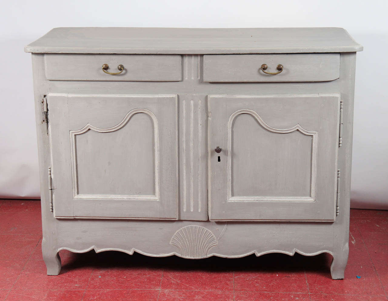 19th century Louis XV French painted buffet server. Can be used in a Swedish Gustavian setting as well. Light grey wash finish, brass handles, pewter knob. Bottom has one shelf.