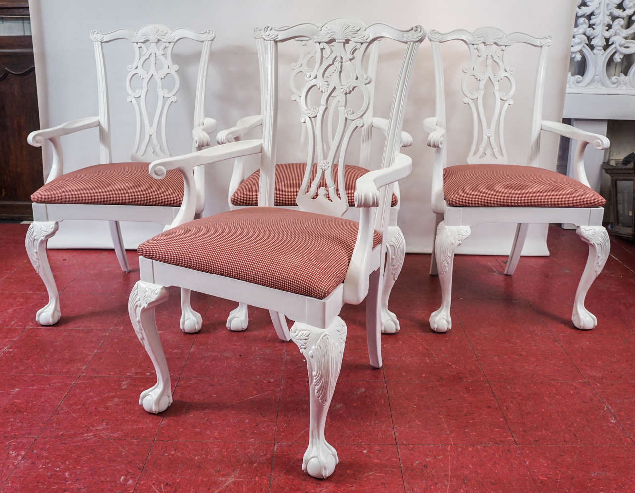 Classic Chippendale style dining armchairs with scroll backs and ball-in-claw feet.
Measures: Arm height 26