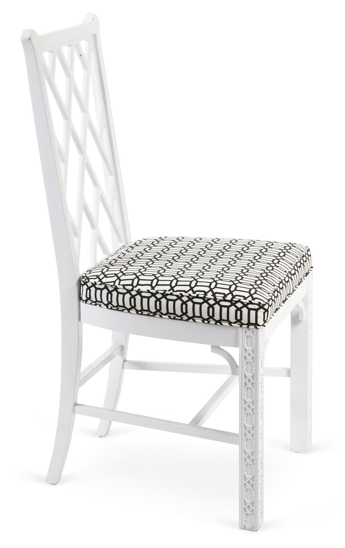 Pair of vintage side chairs with fretwork-style backs. Legs have stunning carved incised detailing. Black-on-white linen seats. Solid construction.