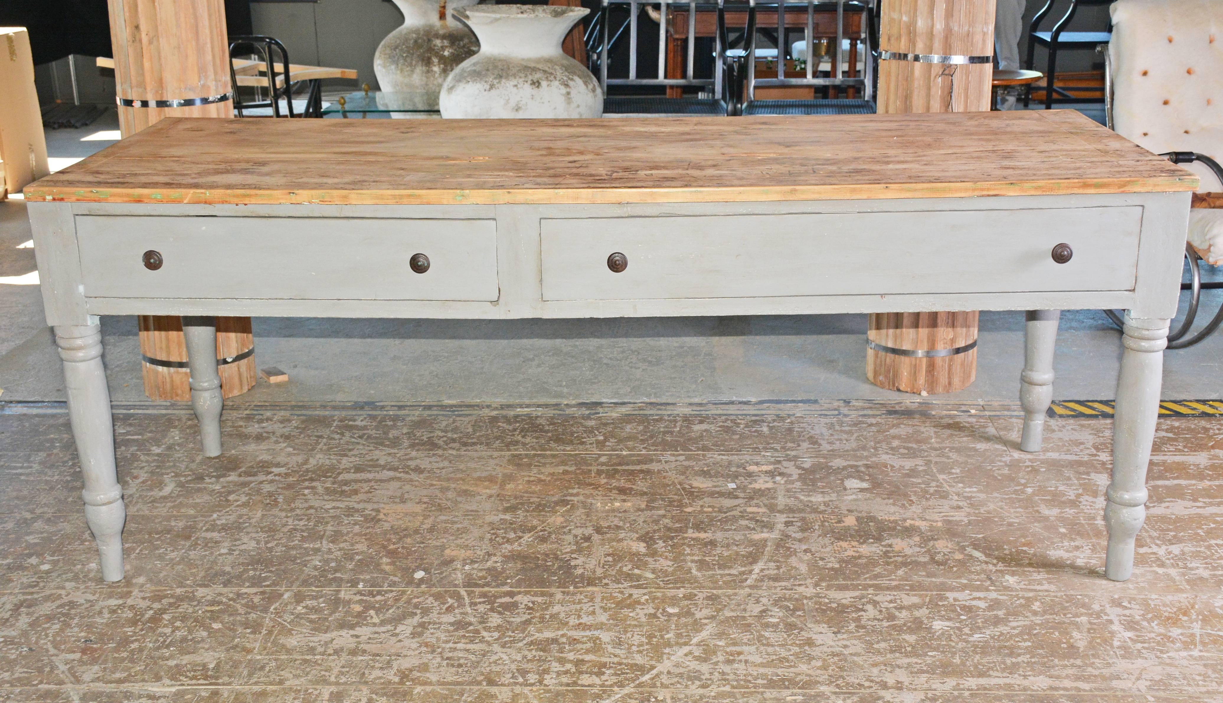 This country worktable kitchen counter can be used as a kitchen island, sideboard or a counter. Top has been stripped, leaving a great patina. Table has turned legs, two large drawers for storage. Finished in a French grey. Can work perfectly in a