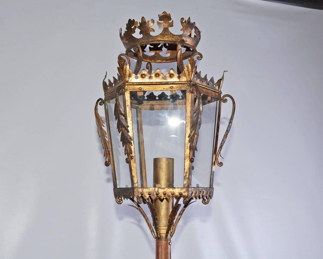 Gold gilt metal Italian processional lantern wired and mounted on a lamp base with single light flame candle lighting fixture.