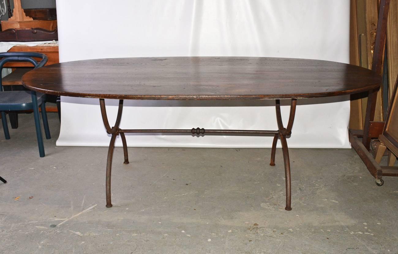 Elegant and rustic at the same time,  this custom made wrought iron garden dining table base can be used indoors or outdoors, porch or patio.
Iron shows rust but can be removed and coated to protect.  The oak as shown is no longer available.
We can