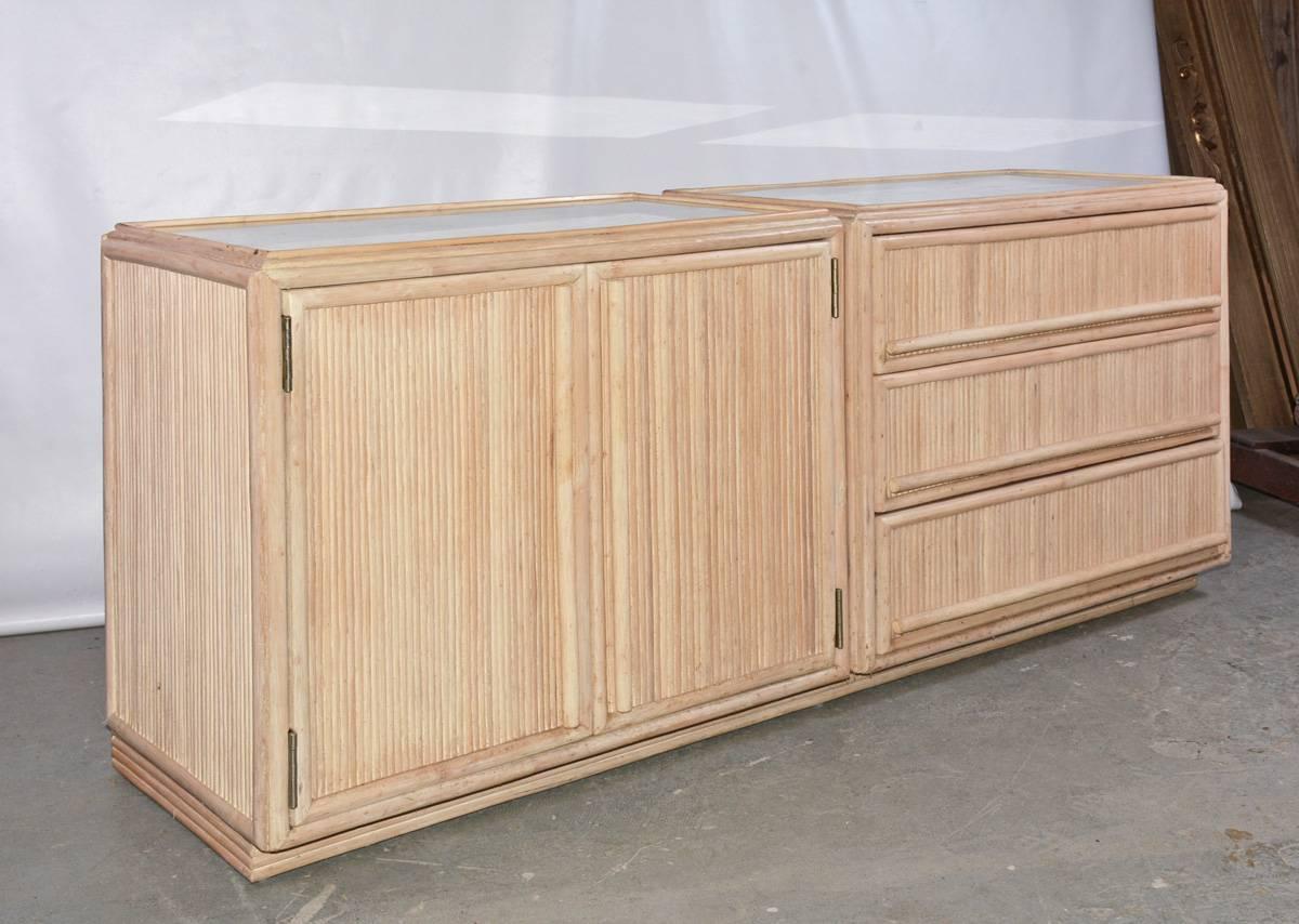 The contemporary piece of furniture is a combined cabinet and chest of three drawers side by side that are secured to an inset platform at the bottom or can be used as two separate pieces for nightstand or as end tables. The surfaces have the effect