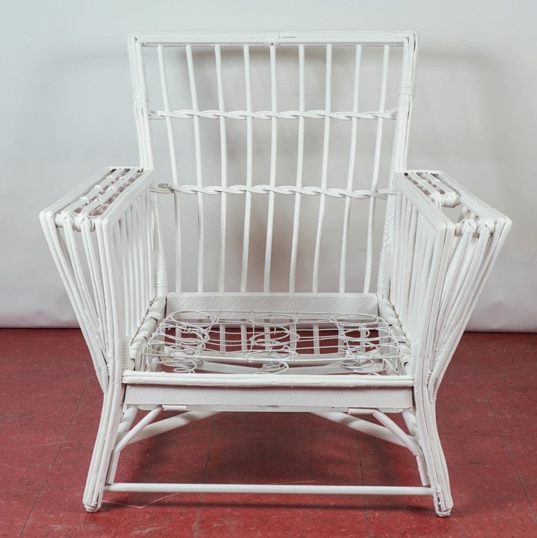 Generous in size, this rattan wicker lounge chair has a wide and deep seat, as well as an arm pocket for reading material. The spring bottom will hold an upholstered cushion of your choice. 

Seat height 10.50".
Arm height 21.50".