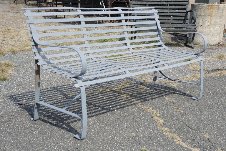 Classical strap metal garden bench with graceful curves made originally for a public park, the bench can grace a private garden just as well. Newly sand blasted and painted with grey primer that can be finished in any custom color.
