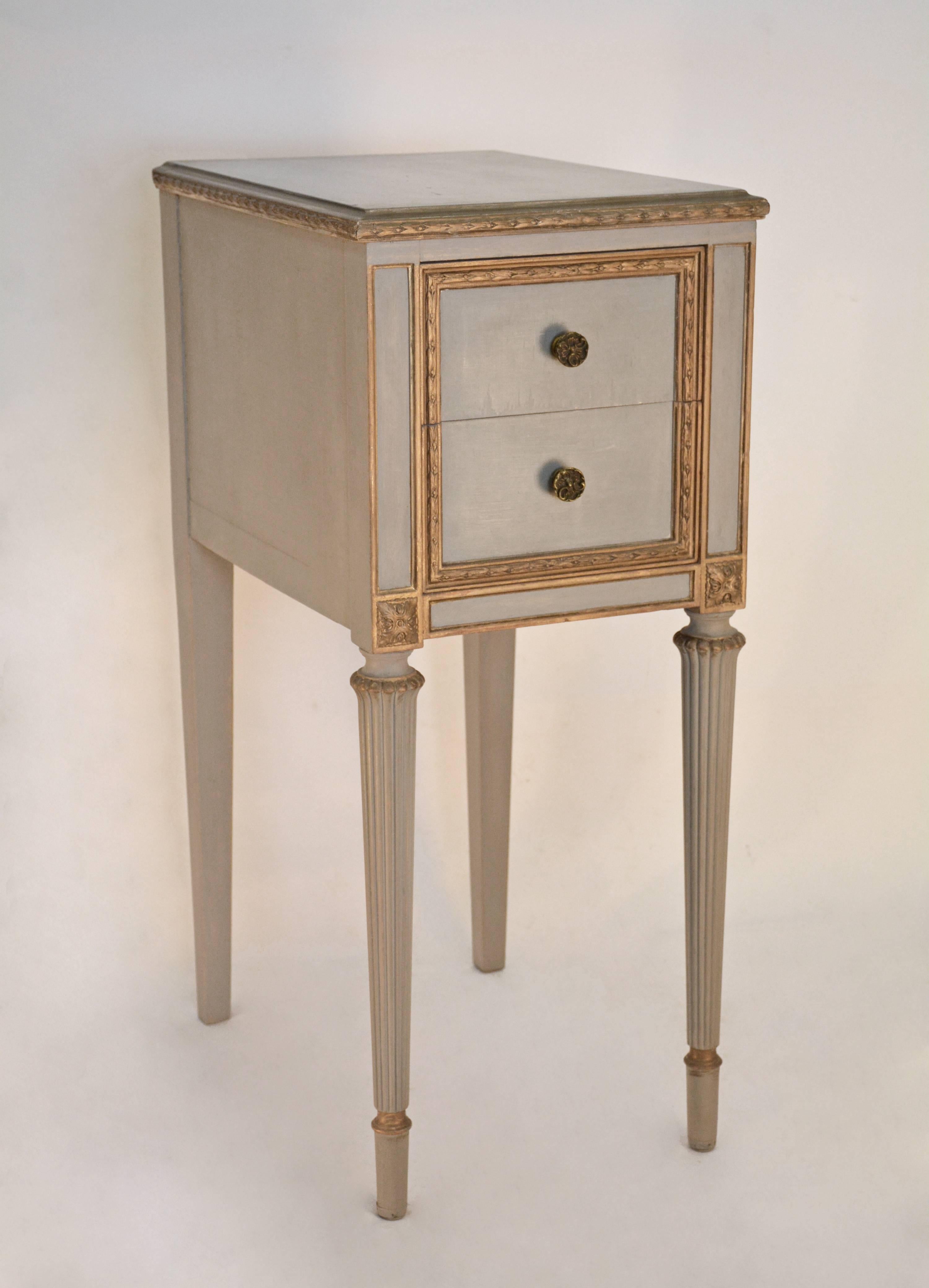 Painted light gray with gilt bay berry and leaf, as well as other trim.  The night stand has two dovetail drawers with brass pulls and fluted legs. 