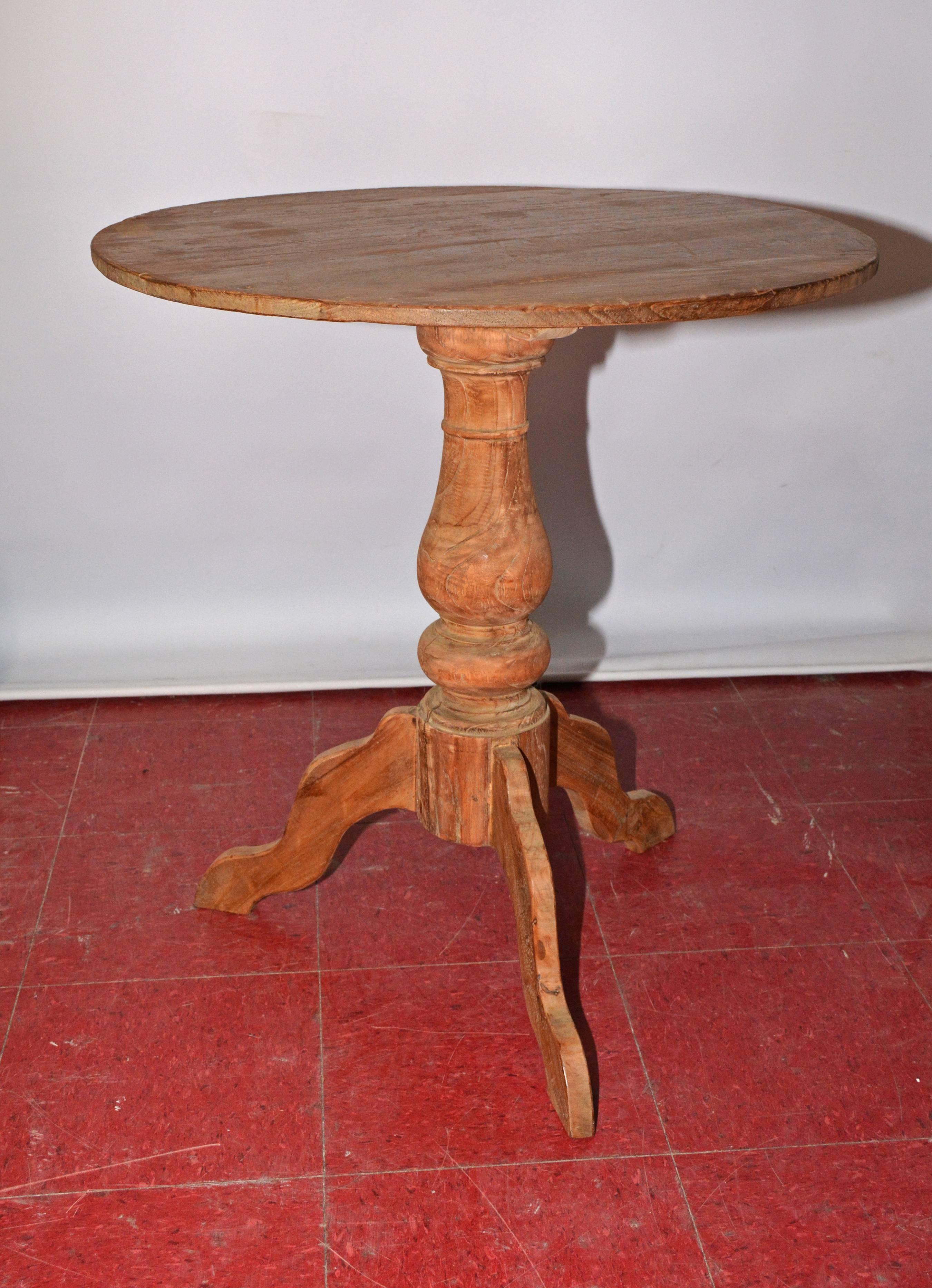19th century rustic country teak table, tea or wine table has a turned pedestal and three splayed legs. Perfect for a lamp, side or end table.
Search term: Gustavian style.