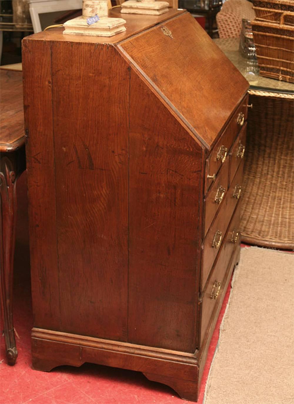 Very handsome Georgian lowland oak secretary with walnut trim.