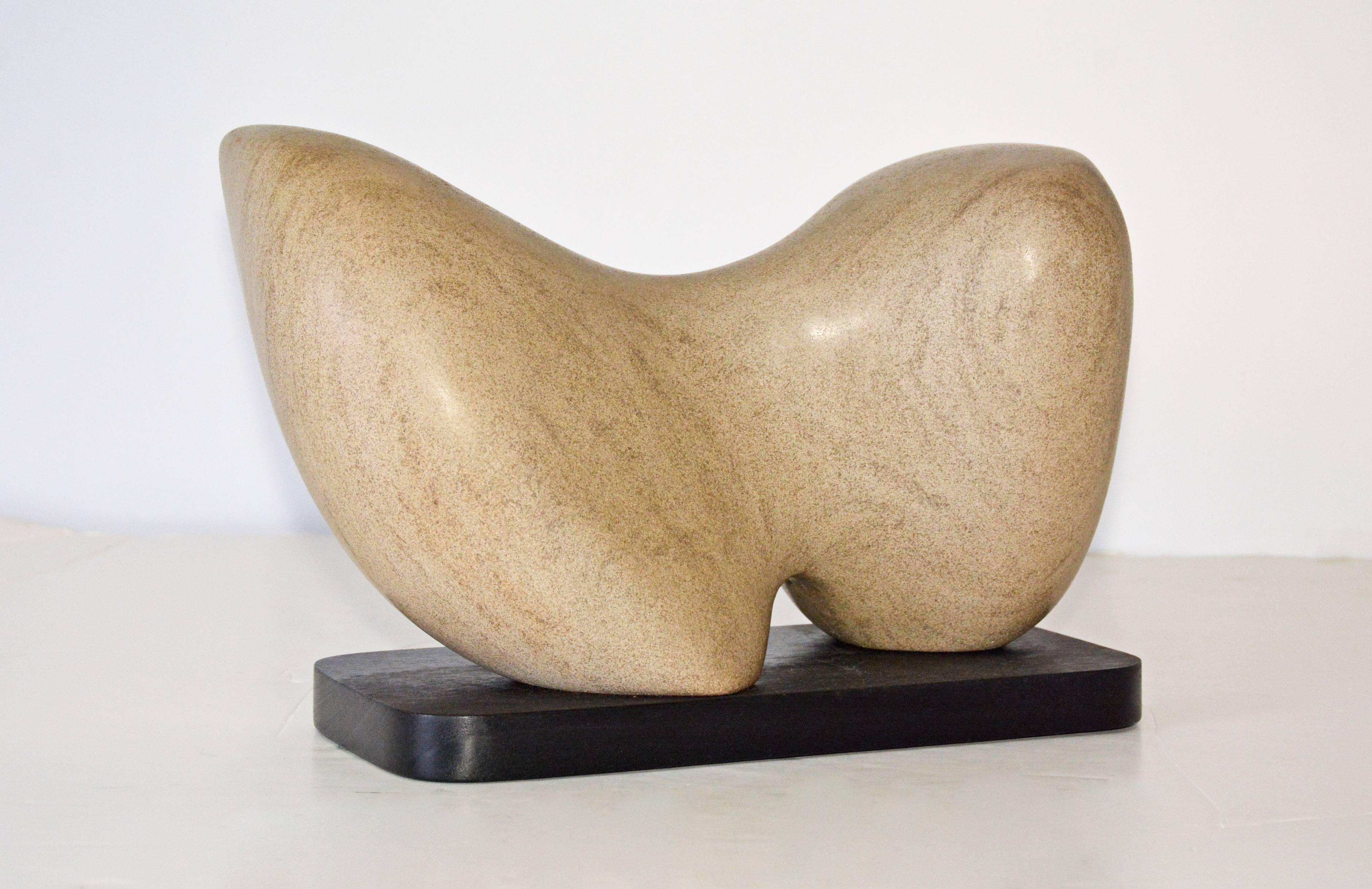 Award winning sculptor Jean Downey (1931-2009). The contemporary brown marble sculpture sits on a black wood base.
Jean Downey was born in Canada, studied art in Illinois, New York and Connecticut. Her work is included in private and corporate