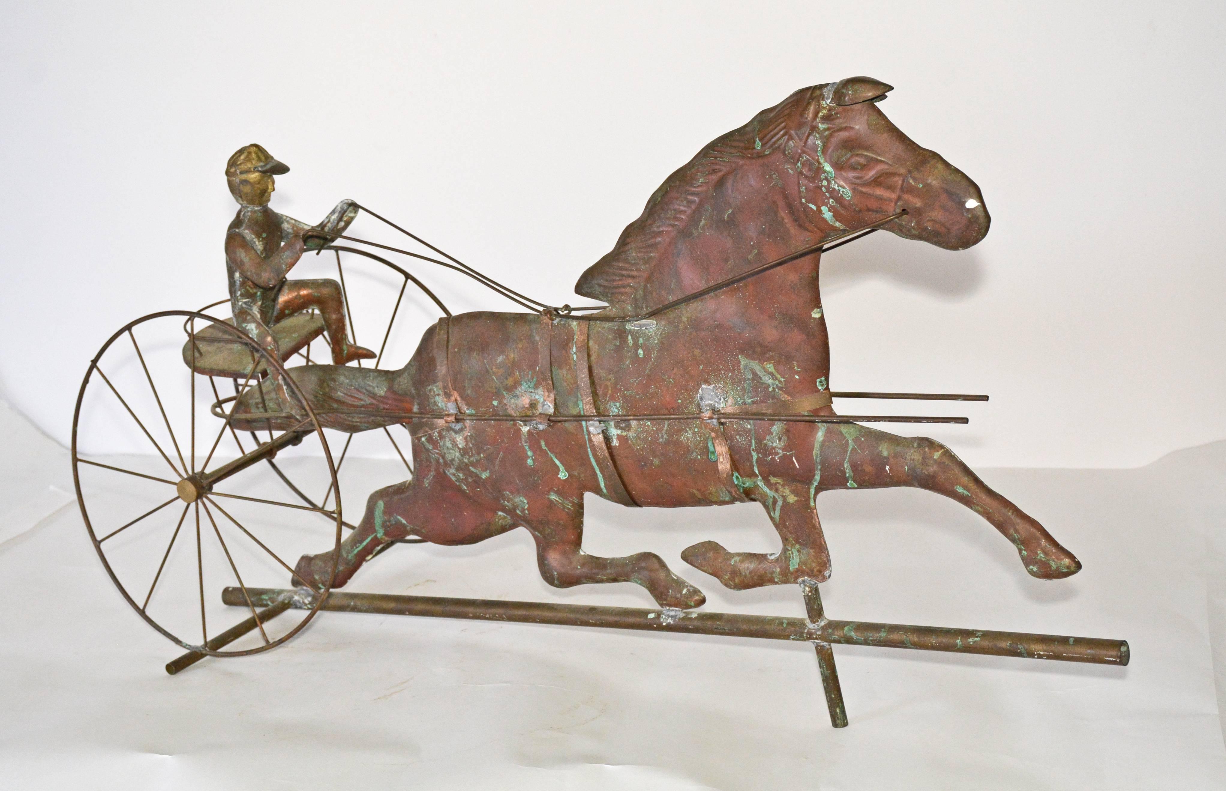 A piece of American Folk Art, trotting horse and seated jockey are handcrafted in copper with appropriate equipment needed for the sport. The parts are soldered together.
    