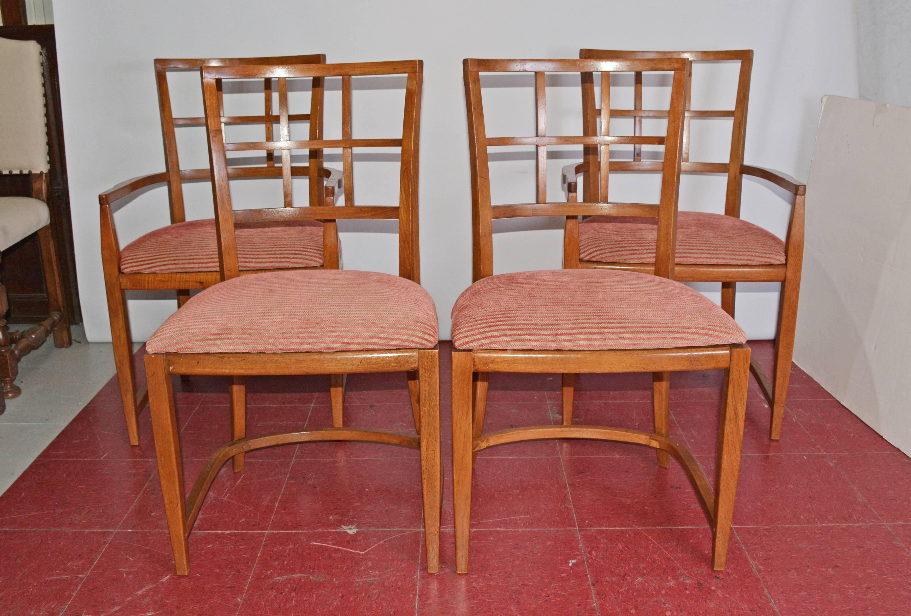 The four Art Deco dining chairs, two arm and two side, have rounded leg framing and backs. The seats are newly upholstered in ribbed red and tan striping.

Measures: Armchairs: 21
