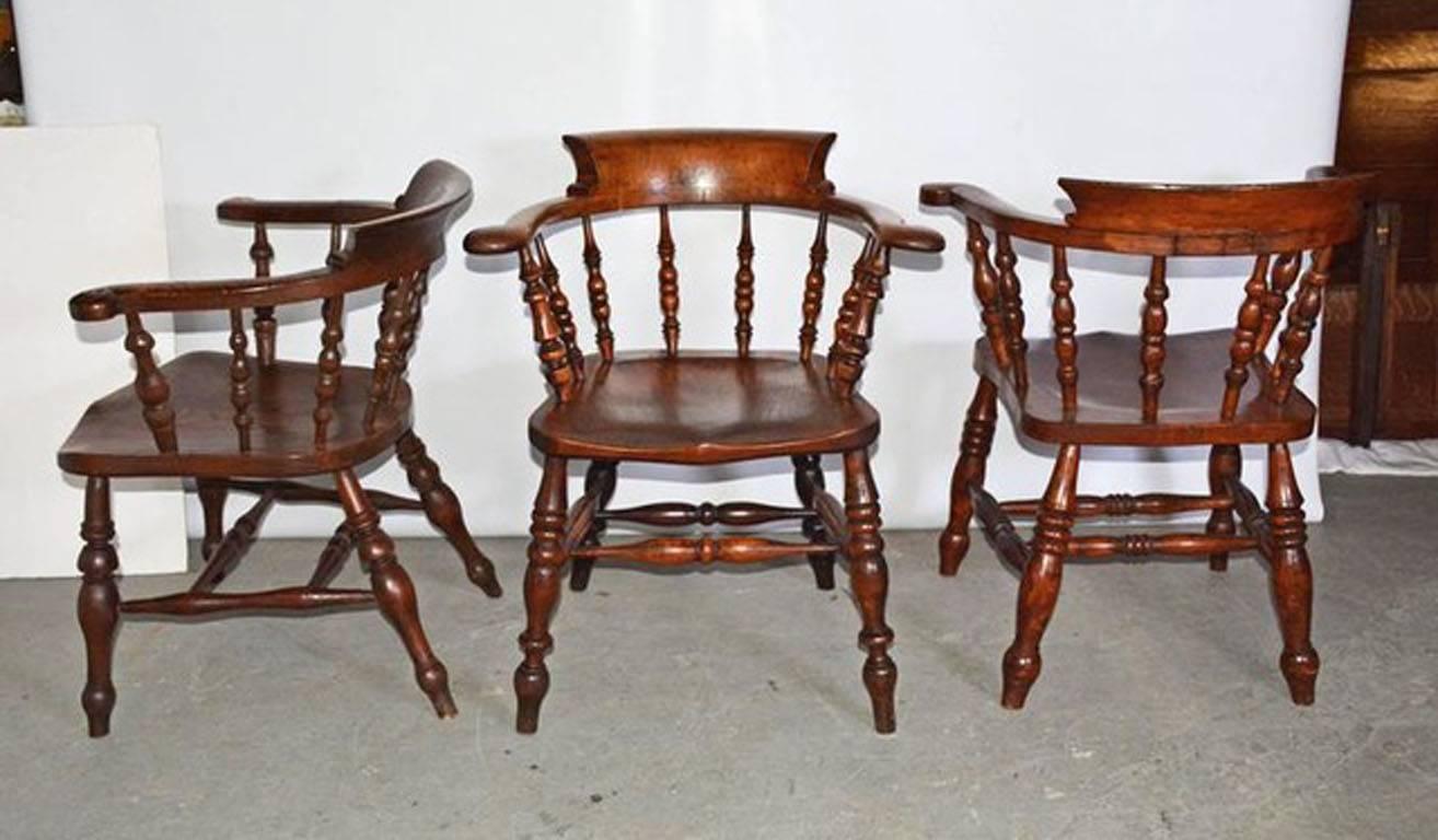 These chairs have boldly turned legs and spindles, hand-carved seats and back panels with an elegant sweep combined with solidly built oak construction including double stretchers. Chairs are made with oak and elm. Wonderful patina. All chair