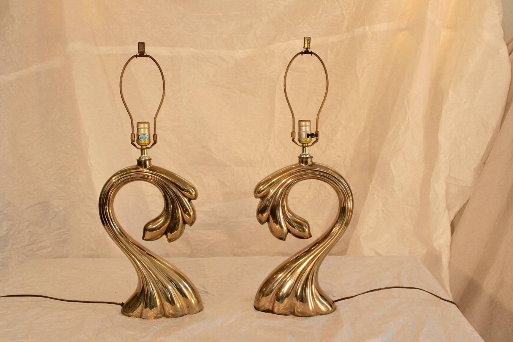 Pair of Mid-Century signature Pierre Cardin brass wave lamps
Height is 16 inches to the bottom of the socket.
 