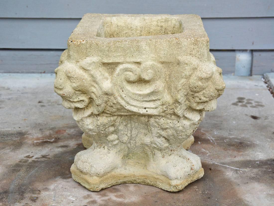 The square antique garden jardinière made of stone is embellished with four lion's heads and feet. Wonderful garden element.


Top measurement: 10.75