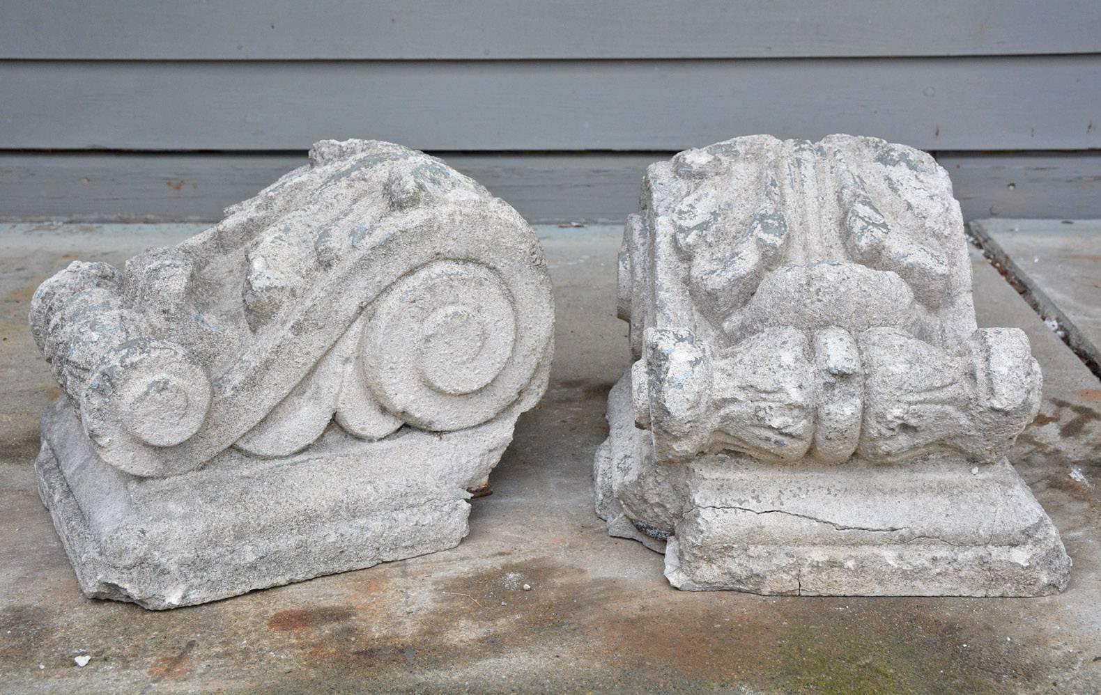 The pair of antique cast stone corbels are hollow and are secured with iron horizontal and vertical bars.

Dimensions are for each corbel.