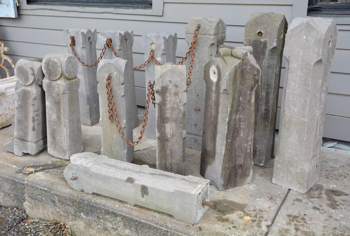 The collection of 12 19th century stone markers made of stone and come in different styles. Six have hooks for attaching the chain. Perfect to use as post for house number. Sold singly.

1. Small: 6.38