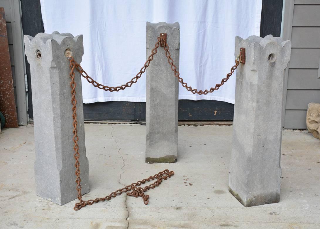 The three French 19th century stone marker or barricade balustrades are carved and have iron hooks for linking the chain. Great to use to indicate house number.

Dimensions are for each balustrade.
Chain length, 125