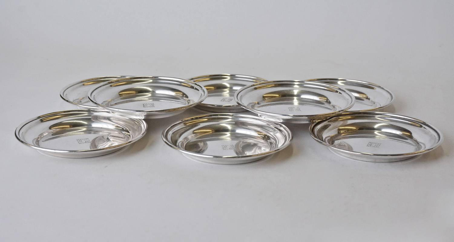 The eight round Art Deco wine glass coasters are marked 