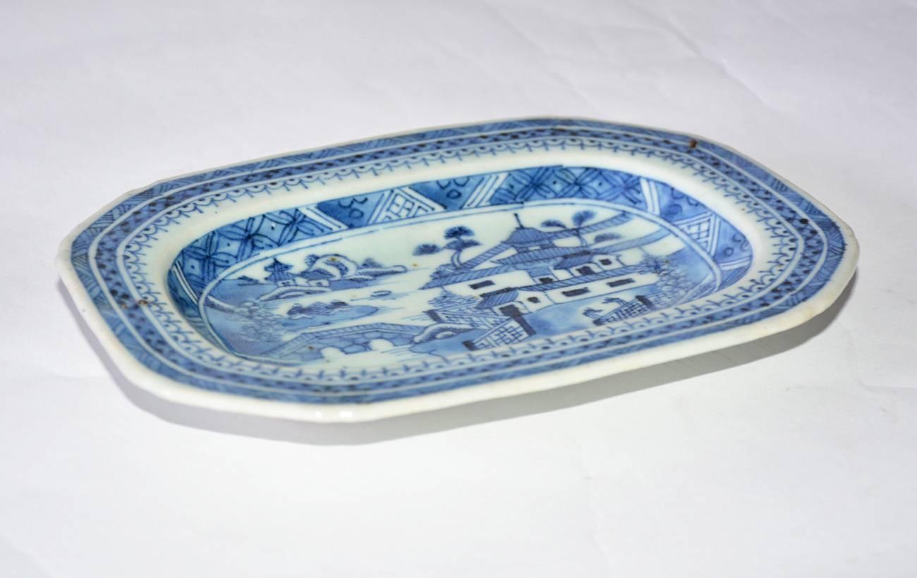 Antique Chinese blue and white Canton export plate or platter featuring traditional landscape scene with bridge.