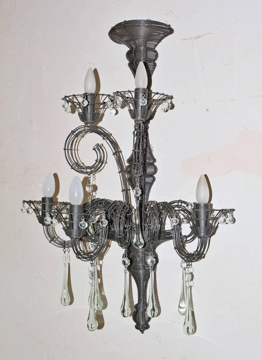Pair of Carlo Rampazzi vintage sconces composed of black wire hung with clear crystal tear and ball drops. Each sconce has five lights, two above and three below, and is wired for US use for flame bulbs.