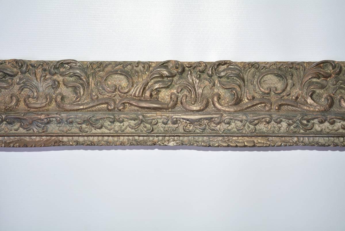 The Renaissance-style wood carved and gilt frame has a molded design with flourishes of leaves and scrolls. Can be used for painting or a mirror.

Inside of frame - 19.88