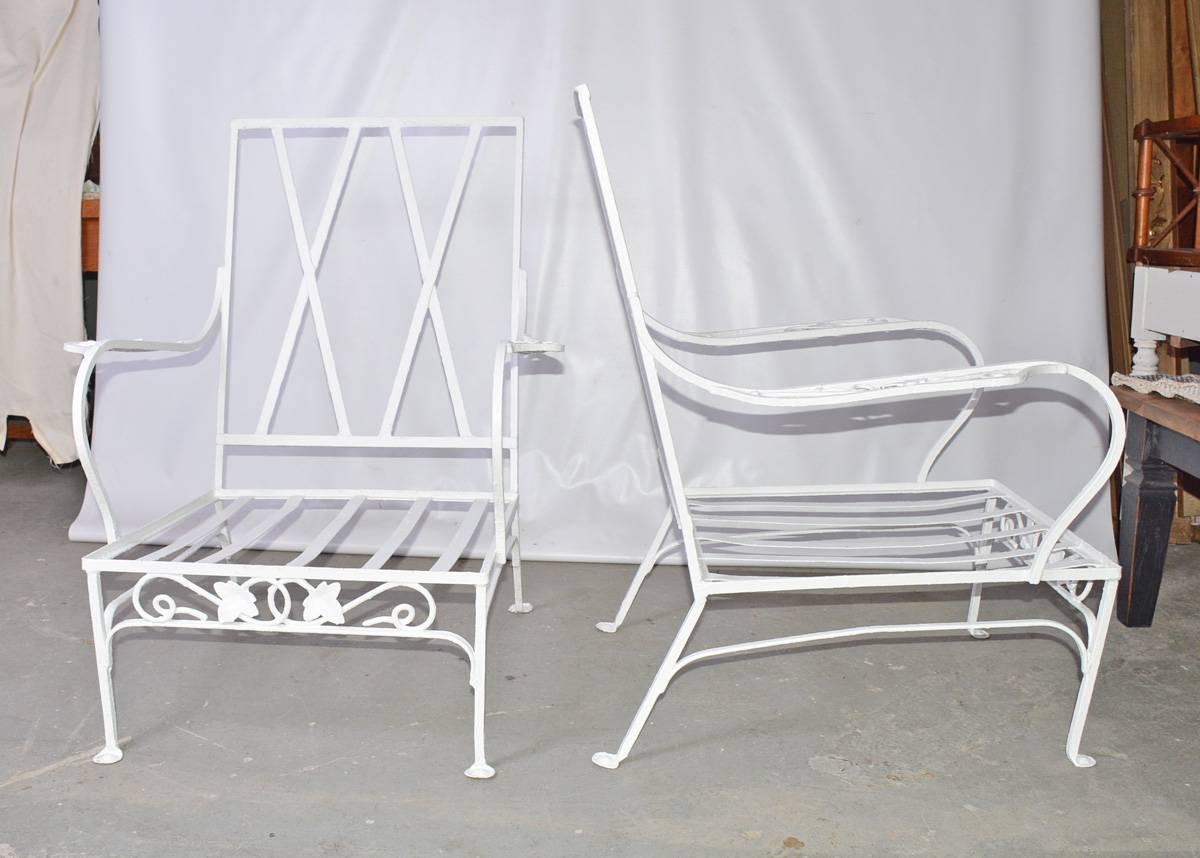 Pair of vintage wrought iron arm chairs by John Salterini, in the Iconic Mt Vernon pattern are painted white, decorated with leaves and vines. The chairs are ready for the back and seat cushions of your choice.

Arm height: 22.75