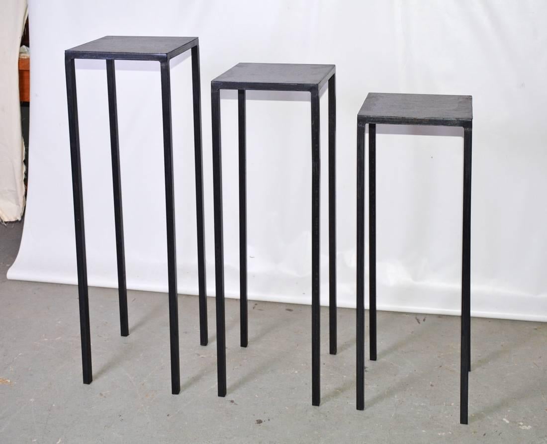 The three contemporary display or sculpture stands have varying heights and the same width and depth dimensions. They are made of black iron with a brushed texture. These can be made to your specification with various finishes.
$1175 for the