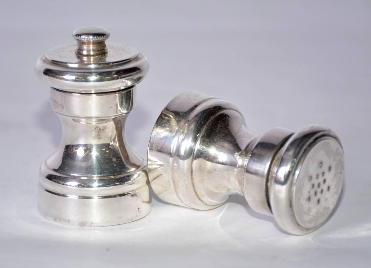 Add style to your dining table with these vintage Italian salt shaker and matching pepper grinder are silver plate with wood liners to prevent corrosion. The shaker has a screw top and the grinder has a screw-on-and-off finial. Both are stamped