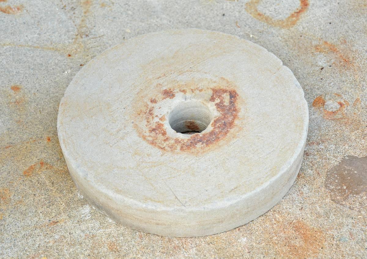 The vintage mill 'stone' is made from cast concrete. It has the look of stone and will make a great decoration in a garden or home entrance.

Diameter for the hole: 1.75