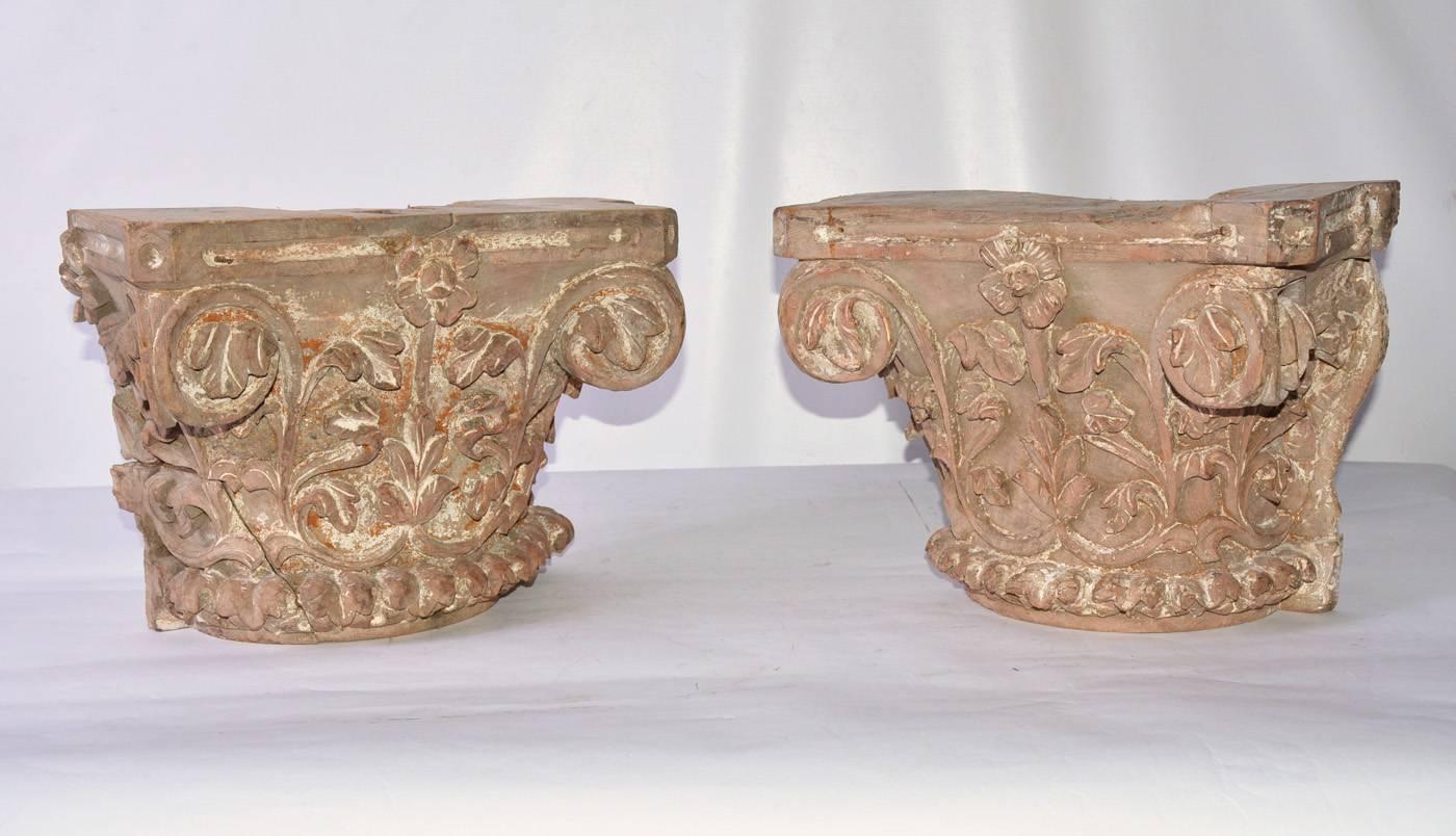 The antique Corinthian pilaster capitals are made of hand-carved hardwood. They are embellished with leaves and flowers. Leaves even protrude from the scrolls, which according to ancient theory are based on ram's horns.
Can be used as side table or