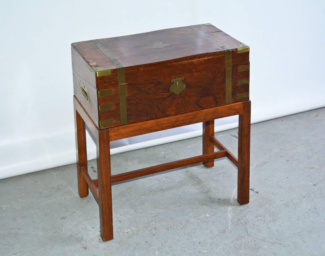 19th century British officer's Campaign chest with brass straps, brass handles and fitted interior with custom stand used as side table or occasional table.
Case height: 6.5 inches.

 