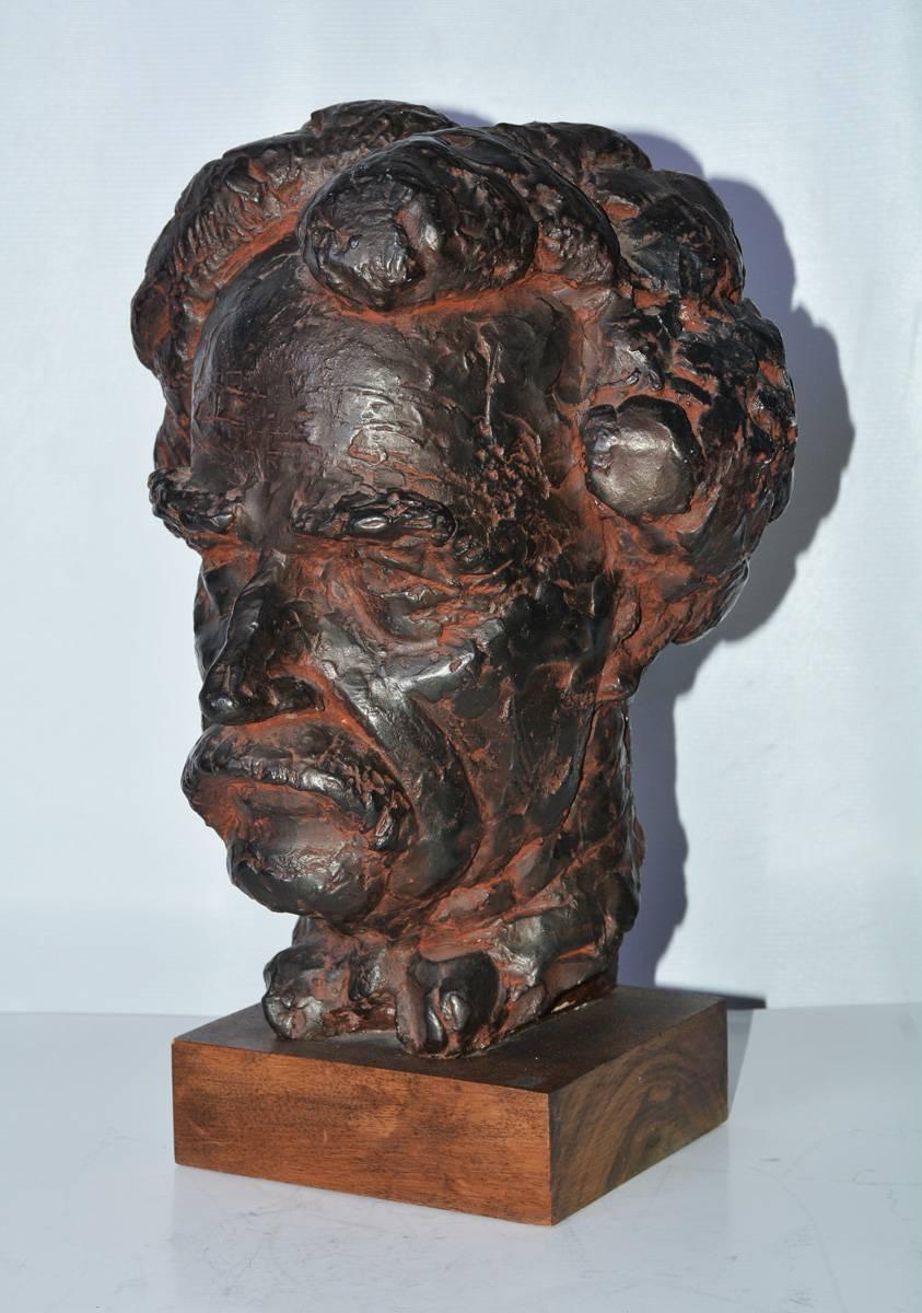 Bust/Head, a bronzed plaster sculpture cast of Mark Twain with lifelike details.
 