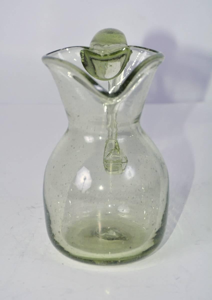green glass pitcher antique