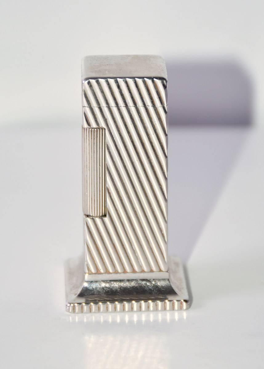 Elegant and stylish, the Dunhill Rollalite 'Diagonal Line' is one of the most famous lighters made by Dunhill. It was first manufactured between 1949 in the United State and Switzerland by Alfred Dunhill ltd. The production of the wick lighter
