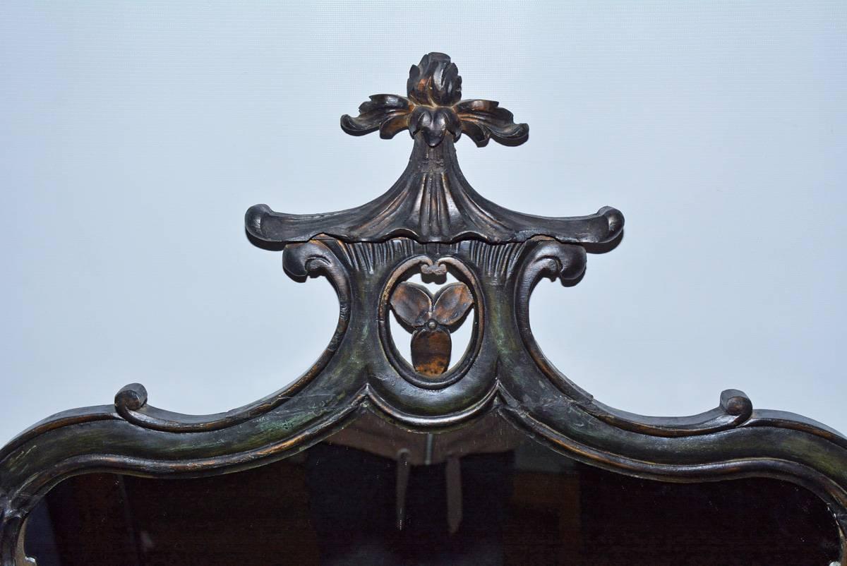 Black Chinese Chinoiserie Chippendale style mirror with stylized garden pagoda.

Measurement for mirror only - W 22.50
