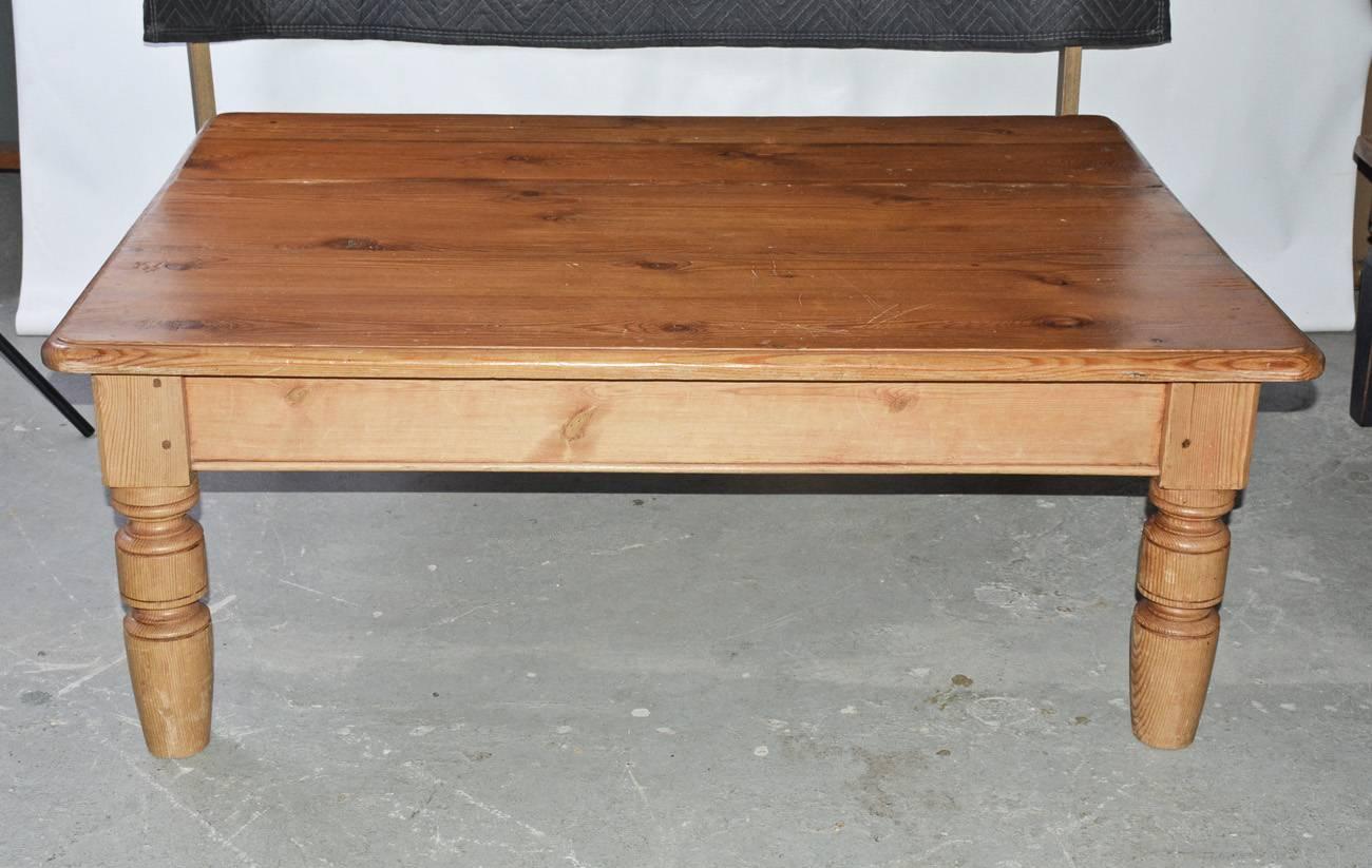 Large antique English pine country coffee table with drawer and turned legs.