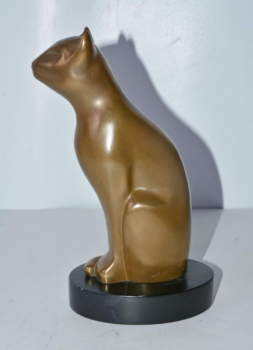 Brass cat sculpture. Sleek and elegant as only a cat can be.