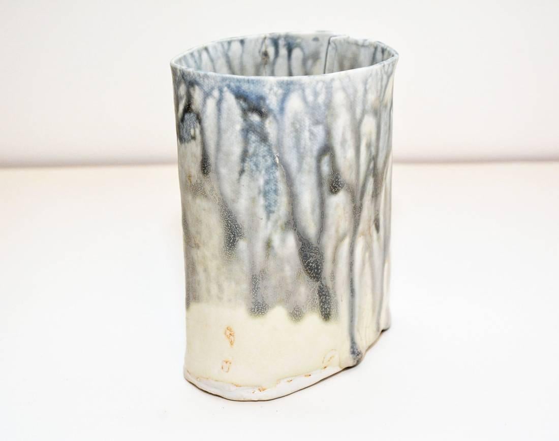 Oval porcelain high fire ceramic porcelain vase with blue grey natural wood ash glaze.