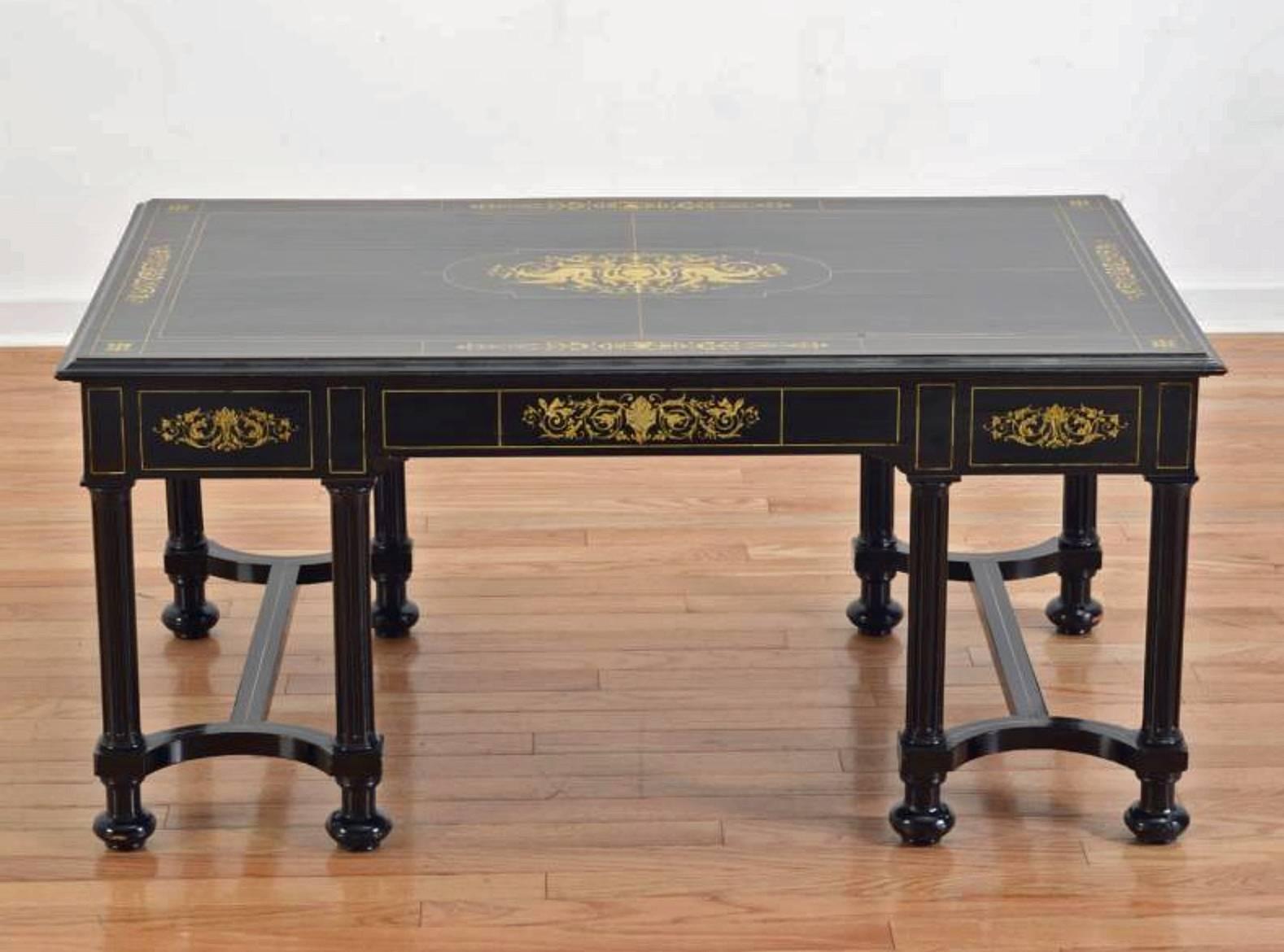 A fine Italian ebonized and marquetry.
Inlaid low table.
19th century.

The rectangular top with marquetry inlaid throughout over a frieze with three dovetailed drawers all resting on columnar legs.

Height 20 in. Width 43 ½ in. Depth 26
