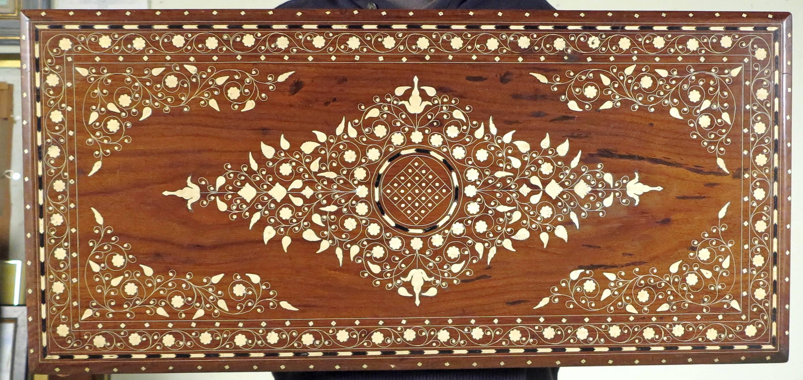 A fine Moorish style inlaid low table.
19th century.

The Shesham wood with bone and ebony inlaid table with a rectangular top all-over four cabriole legs.

Height: 18 ½ in. Width 42 ½ in. Depth 20 in.

Tab303.
$4,200.