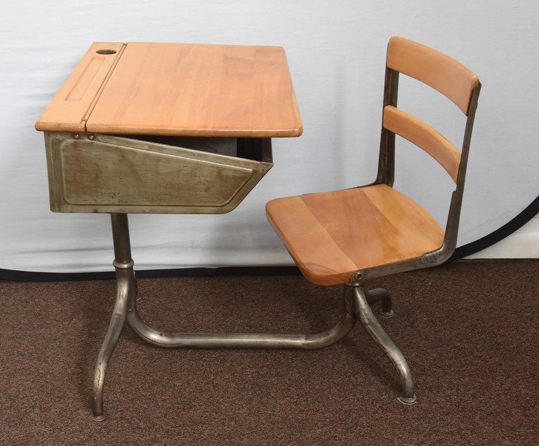 Remember your school days with this charming desk set. Made of steel with beautiful cabriolet legs and maple desk top and chair seat. Flip-top desk, swivel seat on one side only, adjustable height desk and chair. Because of this pretty desk, your