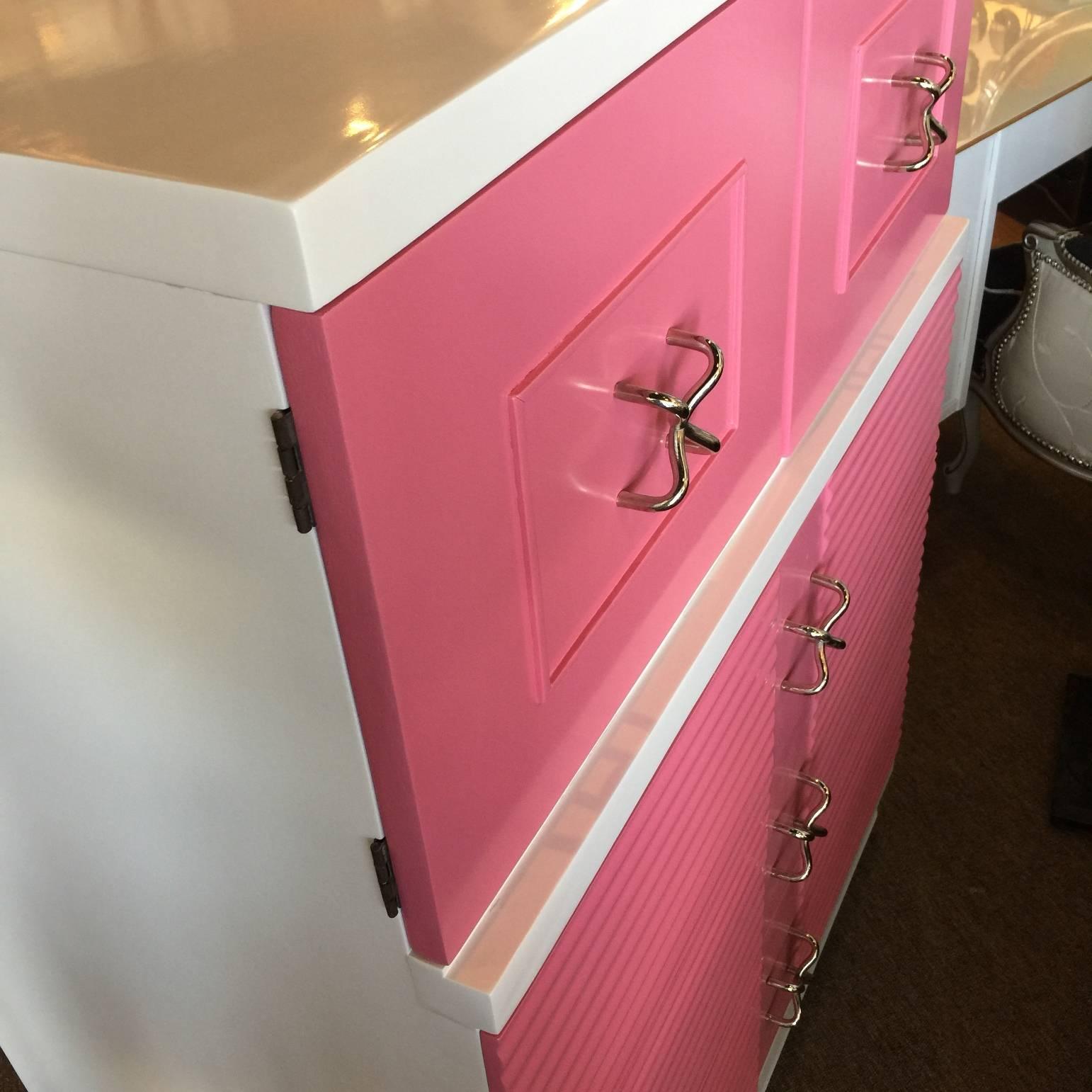 This Mid-Century Modern American of Martinsville; Highboy; dresser that I should write " High Girl" has been lacquered in white and pink. The original handles have been chromed. This is a perfect piece for someone who is looking for tons