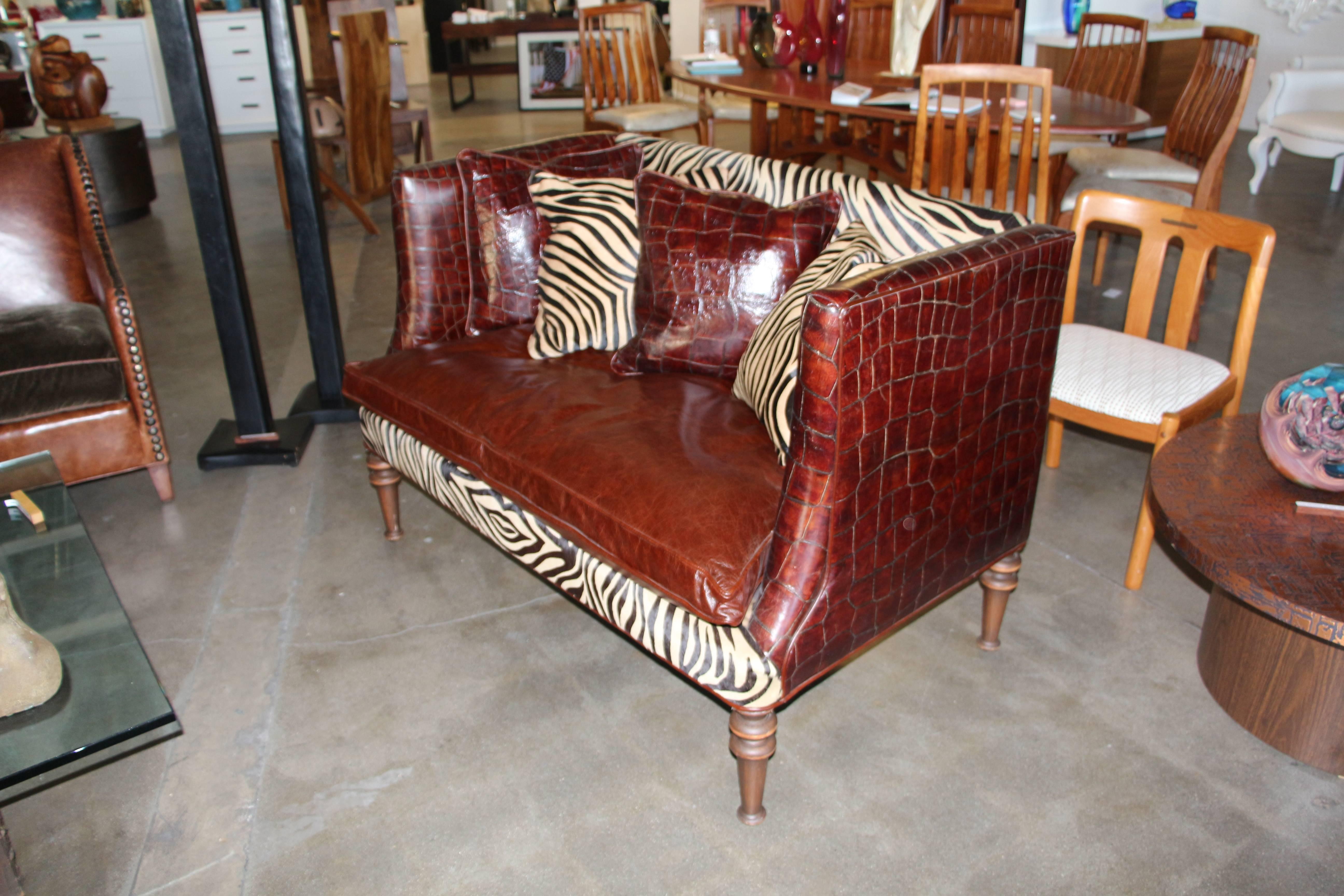 A wonderful loveseat or settee made by the Old Hickory Tannery company in the USA. It features high quality leather in a crocodile or alligator pattern and zebra pattern horsehide. Included are four pillows. This company's products are of extremely