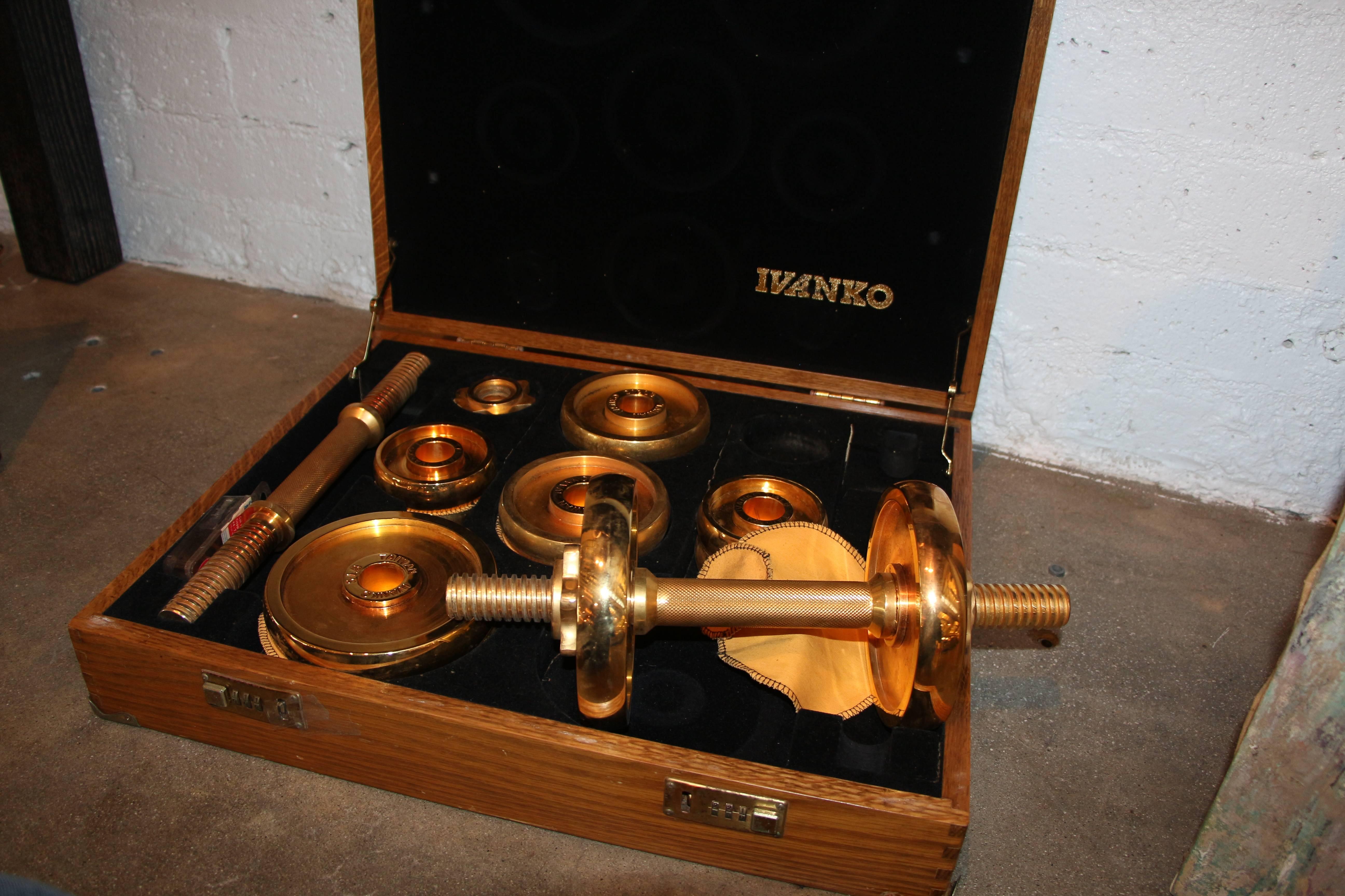 A limited edited Ivanko weight set plated in 22-karat gold made in a limited run in the early 1980s. There are 4 5 pound weights 4 2.5 weights, 4 1.25 pound weights, holders and barbells. The box is a little rough and the locks stick although they